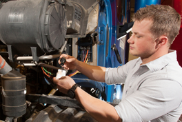 Male student working on truck.